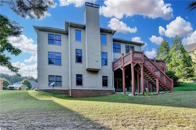 1755 Riverpark Dr, Dacula, GA 30019 - rear view of property featuring a chimney, stairs, a yard, and a wooden deck
