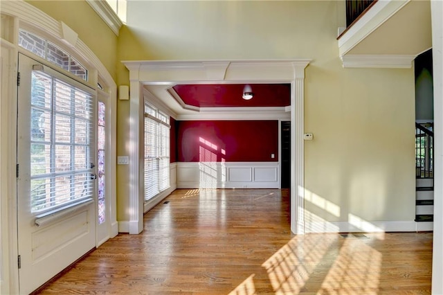 1755 Riverpark Dr, Dacula, GA 30019 - foyer entrance with plenty of natural light, wood finished floors, a decorative wall, a wainscoted wall, and ornamental molding