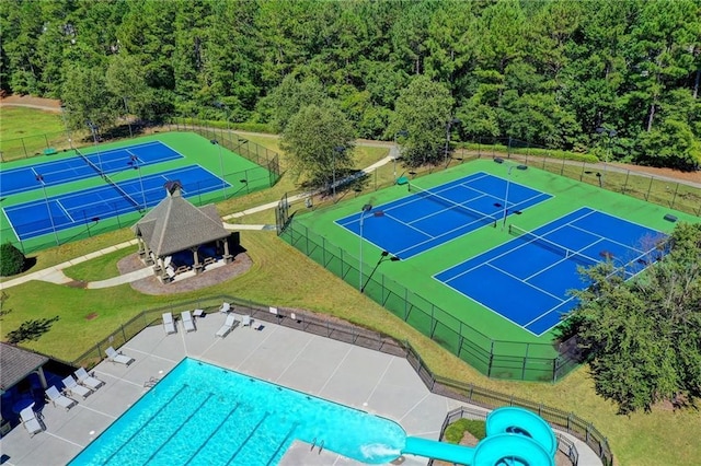 1755 Riverpark Dr, Dacula, GA 30019 - bird's eye view of a pool area and a heavily wooded area