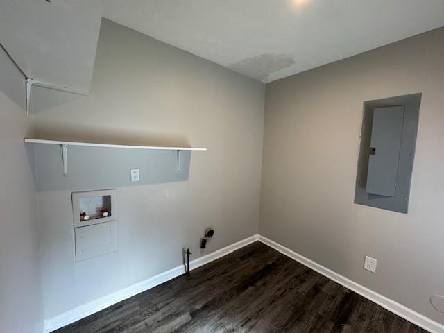 clothes washing area with washer hookup, electric panel, dark wood-style floors, hookup for a gas dryer, and laundry area