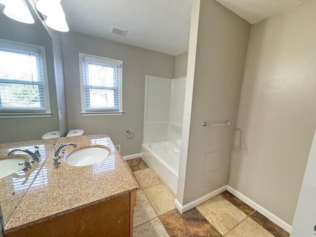full bathroom featuring tile patterned flooring, vanity, baseboards, and visible vents