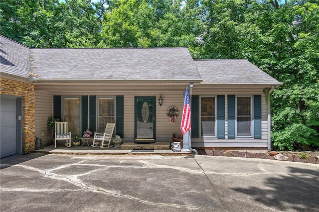 354 Starcross Ln, Jasper, GA 30143 - ranch-style home featuring a porch, a shingled roof, stone siding, and driveway