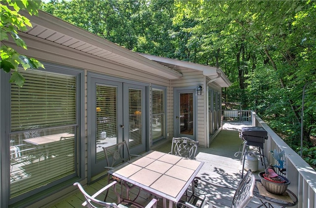 354 Starcross Ln, Jasper, GA 30143 - deck with outdoor dining space and french doors