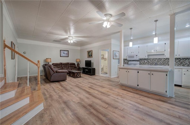 354 Starcross Ln, Jasper, GA 30143 - living room with a ceiling fan, stairs, light wood-style floors, and baseboards