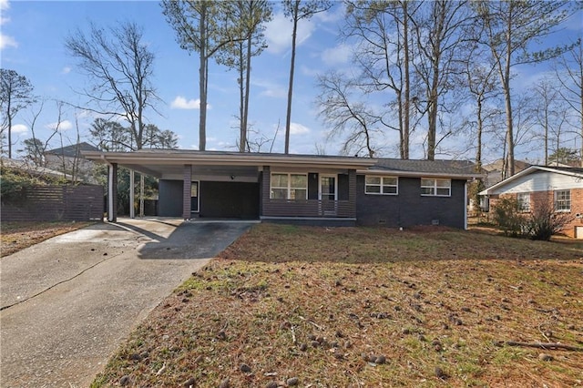 ranch-style house with a carport and a front yard