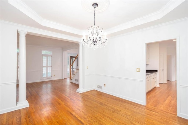 5010 Bonnie Way, Roswell, GA 30075 - empty room featuring stairs, a chandelier, ornamental molding, light wood-type flooring, and baseboards