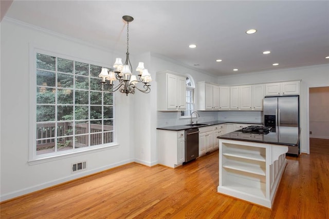 5010 Bonnie Way, Roswell, GA 30075 - kitchen featuring a sink, appliances with stainless steel finishes, open shelves, crown molding, and dark countertops