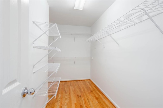 5010 Bonnie Way, Roswell, GA 30075 - walk in closet featuring wood finished floors