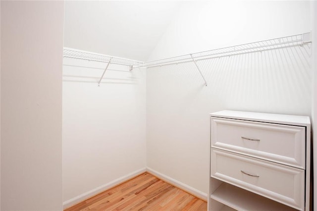 5010 Bonnie Way, Roswell, GA 30075 - spacious closet featuring light wood-style flooring and vaulted ceiling