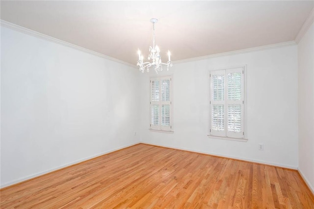 5010 Bonnie Way, Roswell, GA 30075 - spare room featuring a chandelier, crown molding, wood finished floors, and baseboards