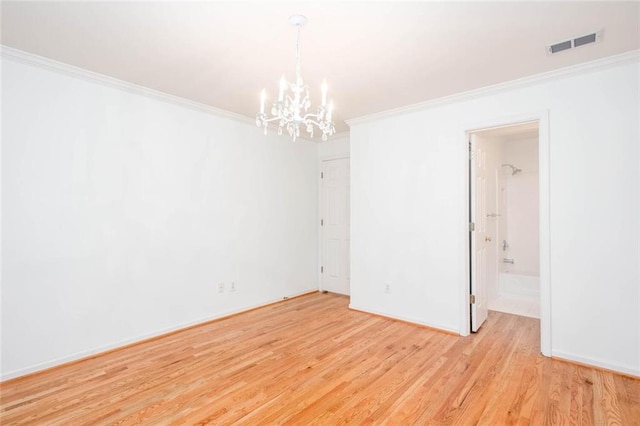 5010 Bonnie Way, Roswell, GA 30075 - empty room with a chandelier, crown molding, light wood-style flooring, and baseboards