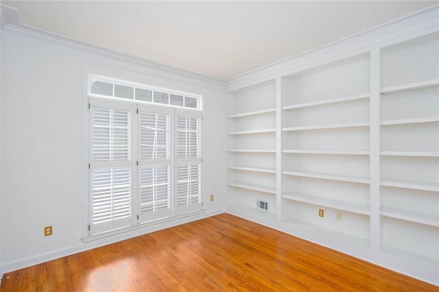 5010 Bonnie Way, Roswell, GA 30075 - empty room featuring wood finished floors, crown molding, and built in shelves
