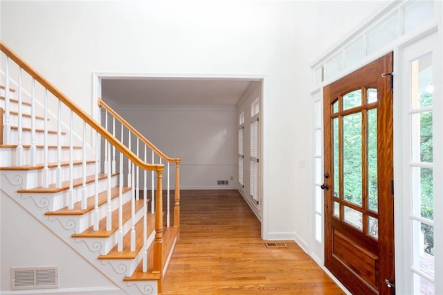 5010 Bonnie Way, Roswell, GA 30075 - foyer entrance featuring light wood-style flooring, ornamental molding, stairway, and baseboards