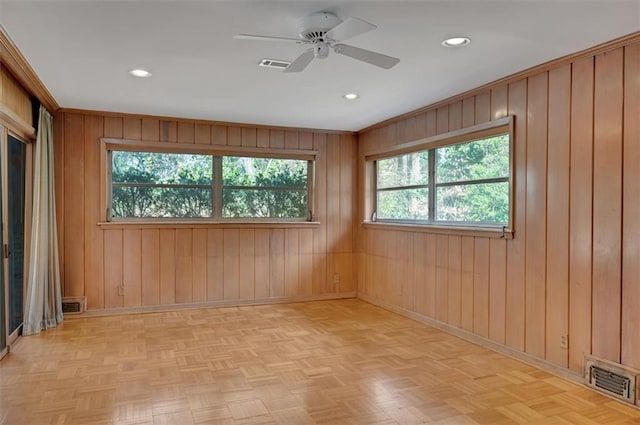 spare room featuring baseboards, visible vents, and recessed lighting