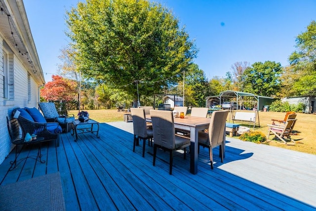 wooden terrace with outdoor lounge area