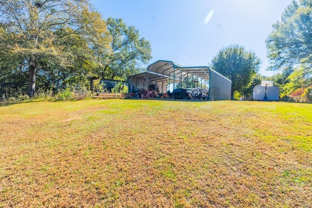 view of yard with a shed and a carport