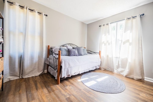 bedroom featuring dark hardwood / wood-style floors