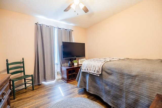 bedroom featuring hardwood / wood-style floors and ceiling fan