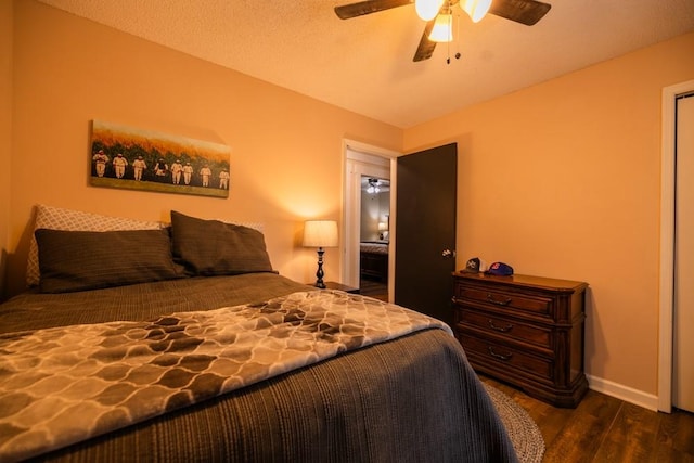 bedroom featuring ceiling fan and dark hardwood / wood-style flooring