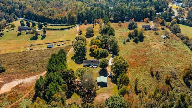 birds eye view of property with a rural view