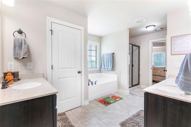 466 Sweet Apple Ln, Buford, GA 30518 - bathroom with two vanities, a stall shower, a garden tub, and healthy amount of natural light