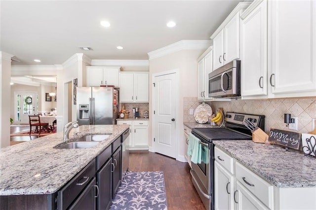 466 Sweet Apple Ln, Buford, GA 30518 - kitchen featuring stainless steel appliances, a sink, white cabinetry, crown molding, and dark wood-style floors