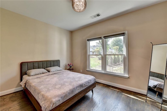 9440 Knollcrest Blvd, Alpharetta, GA 30022 - bedroom with baseboards and dark wood-type flooring