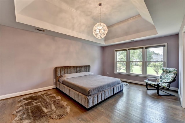 9440 Knollcrest Blvd, Alpharetta, GA 30022 - bedroom with a raised ceiling, a chandelier, baseboards, and wood finished floors
