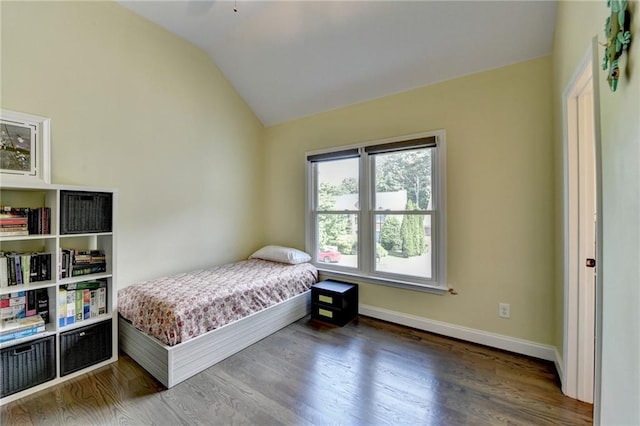 9440 Knollcrest Blvd, Alpharetta, GA 30022 - bedroom with lofted ceiling, wood finished floors, and baseboards