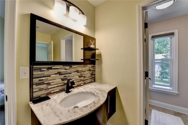 9440 Knollcrest Blvd, Alpharetta, GA 30022 - bathroom with backsplash, baseboards, and vanity