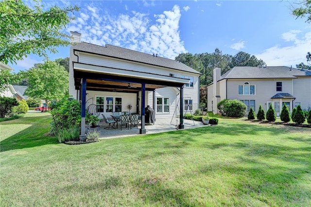 9440 Knollcrest Blvd, Alpharetta, GA 30022 - rear view of property with a patio, a chimney, a lawn, and a ceiling fan
