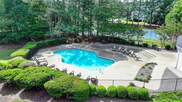 9440 Knollcrest Blvd, Alpharetta, GA 30022 - community pool featuring a patio and view of wooded area