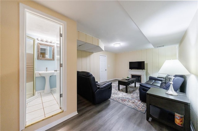 living room with sink and hardwood / wood-style floors