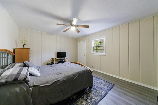 bedroom with hardwood / wood-style flooring and ceiling fan