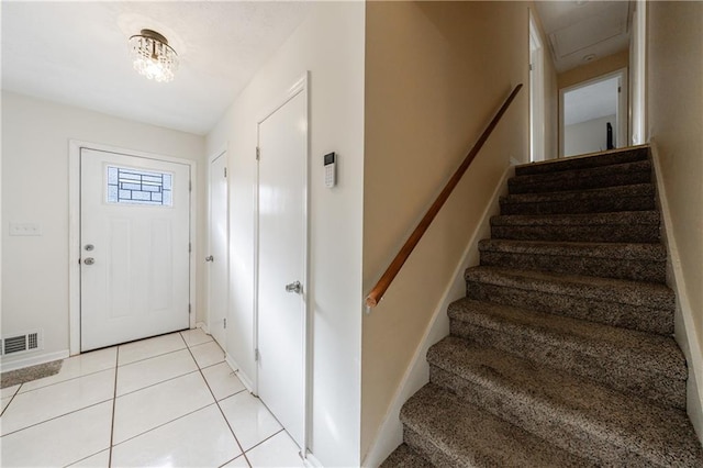 entrance foyer featuring light tile patterned floors