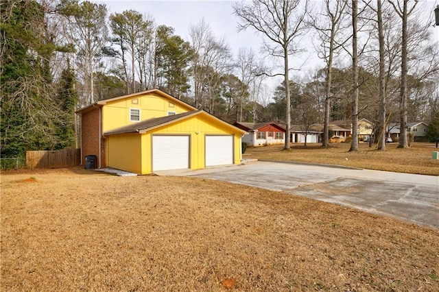 garage featuring a yard