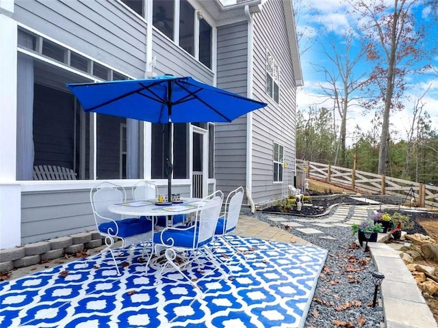 view of patio / terrace with outdoor dining area and fence