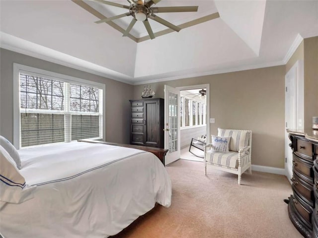 carpeted bedroom featuring ornamental molding, a raised ceiling, baseboards, and a ceiling fan