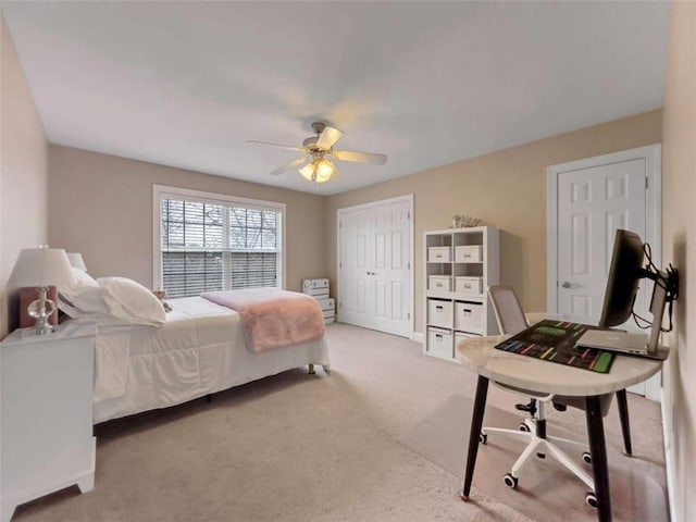 carpeted bedroom with a ceiling fan