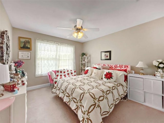 bedroom with carpet floors, a ceiling fan, and baseboards