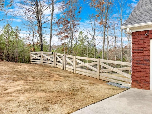 view of gate with fence