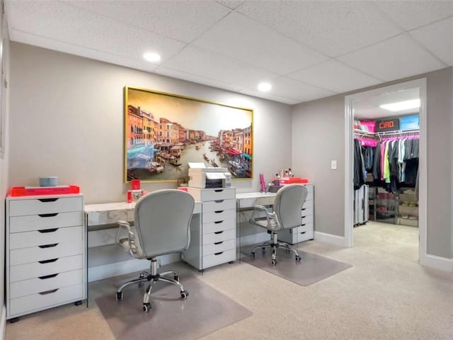 carpeted office with baseboards, a drop ceiling, and recessed lighting