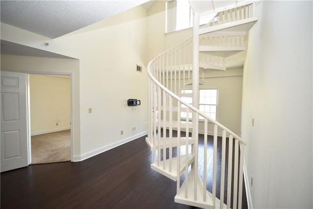 1075 Peachtree Walk NE Unit A519, Atlanta, GA 30309 - staircase featuring baseboards, wood finished floors, and visible vents