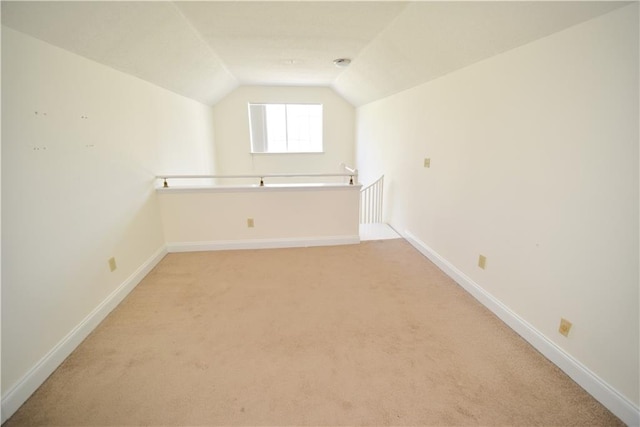 1075 Peachtree Walk NE Unit A519, Atlanta, GA 30309 - additional living space with baseboards, lofted ceiling, and light colored carpet