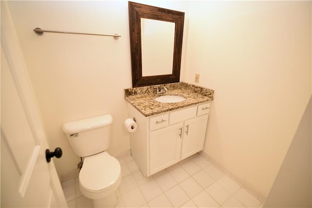 1075 Peachtree Walk NE Unit A519, Atlanta, GA 30309 - half bathroom with baseboards, vanity, tile patterned flooring, and toilet