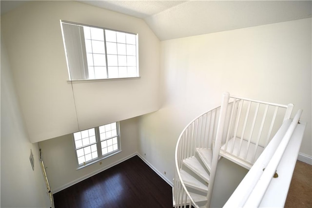 1075 Peachtree Walk NE Unit A519, Atlanta, GA 30309 - stairway with vaulted ceiling, a wealth of natural light, and baseboards