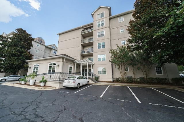 1075 Peachtree Walk NE Unit A519, Atlanta, GA 30309 - view of building exterior with uncovered parking