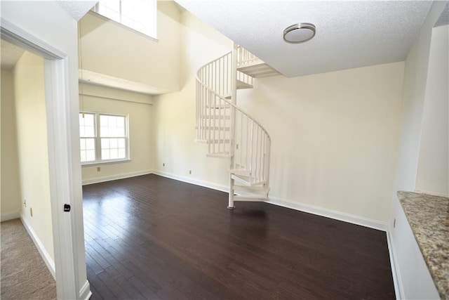 1075 Peachtree Walk NE Unit A519, Atlanta, GA 30309 - interior space with hardwood / wood-style floors, a textured ceiling, baseboards, and stairway