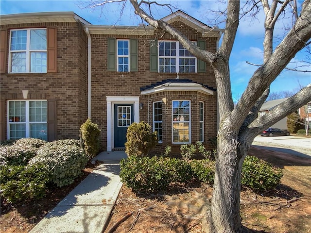 view of front of home featuring brick siding