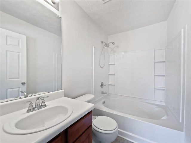 full bath with shower / tub combination, vanity, and toilet